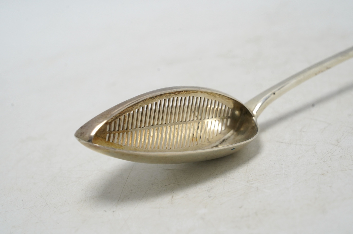 A George III silver Old English pattern basting/straining spoon, Smith & Fearn, London, 1791, 29.6cm, weight 136 grams. Condition - fair